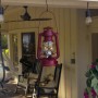 Alpine Corporation 10"H Indoor/Outdoor Metal and Glass Hurricane Lantern with Dimmable LED Lights, Red