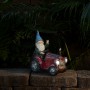Alpine Corporation 10" Tall Outdoor Garden Gnome Riding Red Tractor Yard Statue Decoration with LED Lights, Multicolor